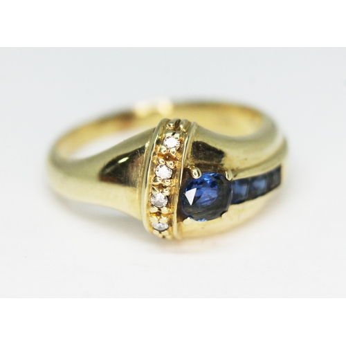 272 - A diamond and sapphire cluster ring, marked '585', gross wt. 6.2g, size R/S.