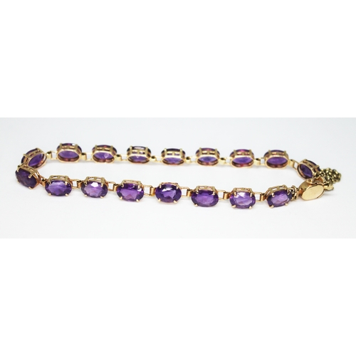 273 - An amethyst set bracelet, marked '14K 585', gross wt. 6.6g.