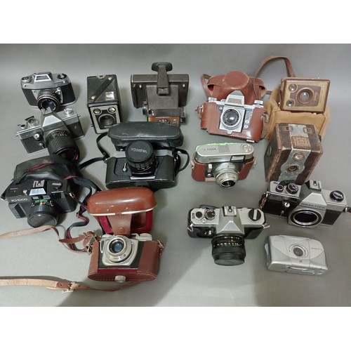 171 - Two boxes of cameras and camera equipment including Bell & Howell Filmo 70 cine camera, Polaroid, Pr... 