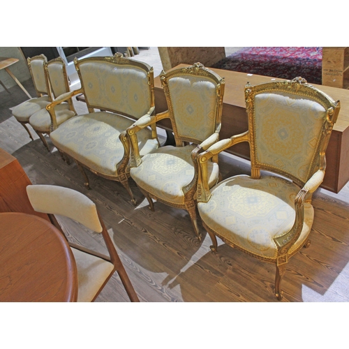 19 - A French giltwood salon suite comprising settee, two armchairs and two chairs, circa 1900.