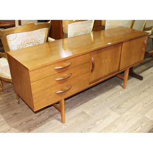 20 - A mid 20th century teak sideboard, length 163cm.