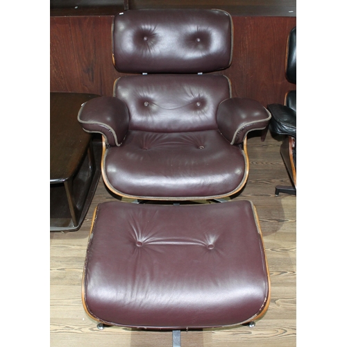 3 - A burgundy lounge chair and matching footstool after Charles & Ray Eames.