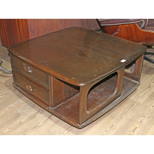 4 - An Ercol dark elm 'Pandora' coffee table, width 80cm.