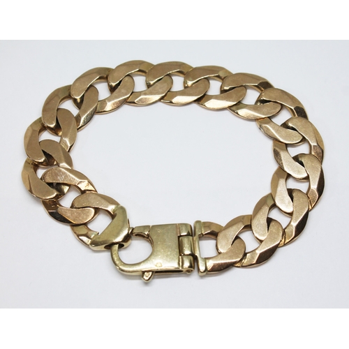 275 - A 9ct gold curb link bracelet, international convention marks, length 21cm, wt. 58.1g.