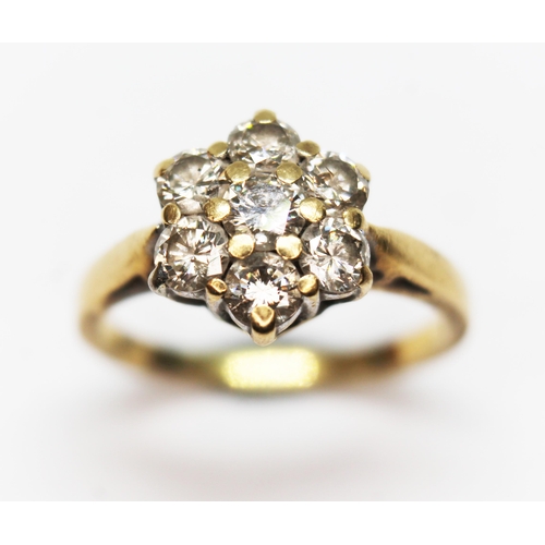 277 - A diamond cluster ring, the seven stones weighing approx. 1ct in total, band marked '18K', gross wt.... 