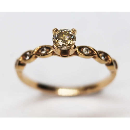 280 - A diamond solitaire ring, diamond set shoulders, band unmarked, gross wt. 2.1g, size N.