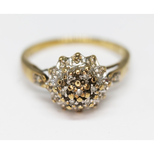 281 - A hallmarked 9ct gold diamond cluster ring, gross wt. 2.2g, size M.