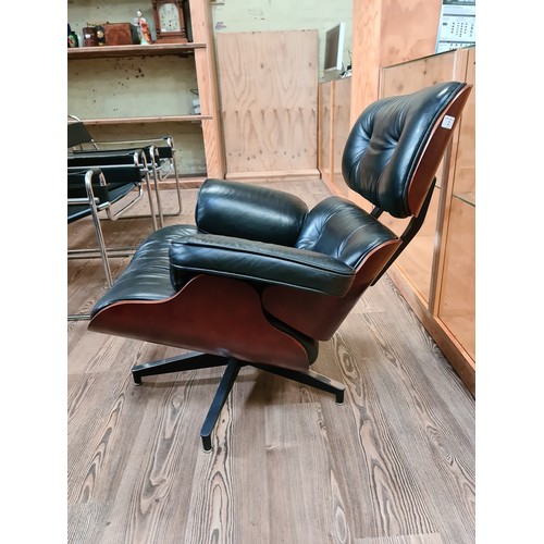 2 - A black leather 670 lounge chair after Charles & Ray Eames.