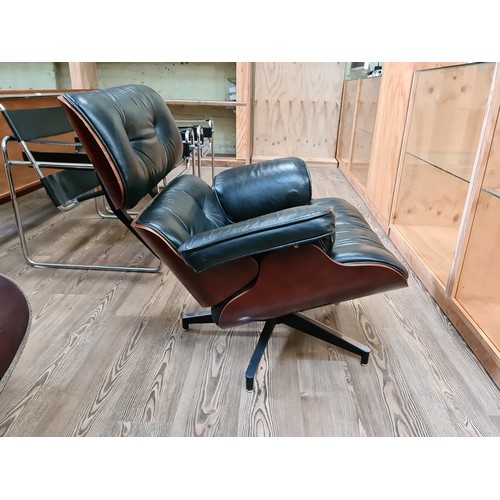 2 - A black leather 670 lounge chair after Charles & Ray Eames.