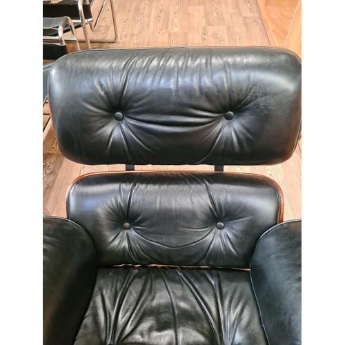 2 - A black leather 670 lounge chair after Charles & Ray Eames.