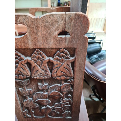 7 - An Art & Crafts carved oak box stool, height 56cm and width 51cm.