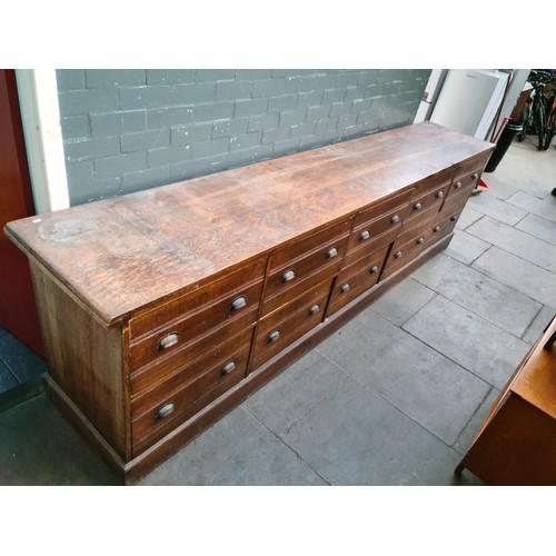 23 - A large early 20th century oak shop counter, originally from a millinery shop in Crosby, height 90.5... 