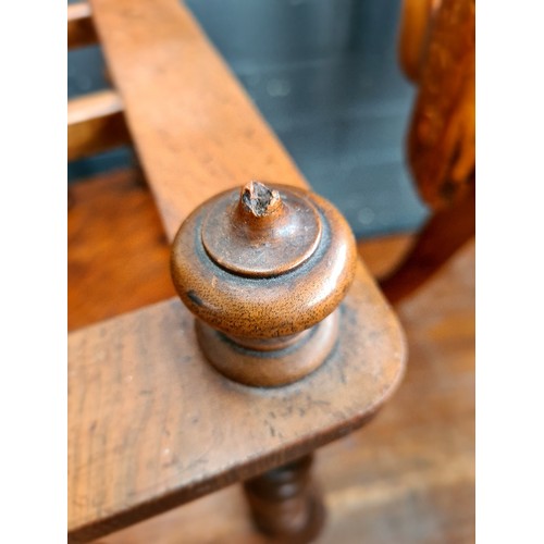 25 - A Victorian walnut Canterbury with twist supports.