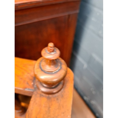 25 - A Victorian walnut Canterbury with twist supports.