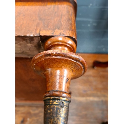 25 - A Victorian walnut Canterbury with twist supports.