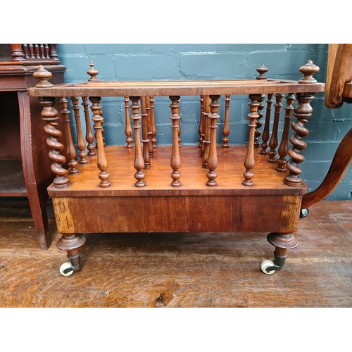 25 - A Victorian walnut Canterbury with twist supports.