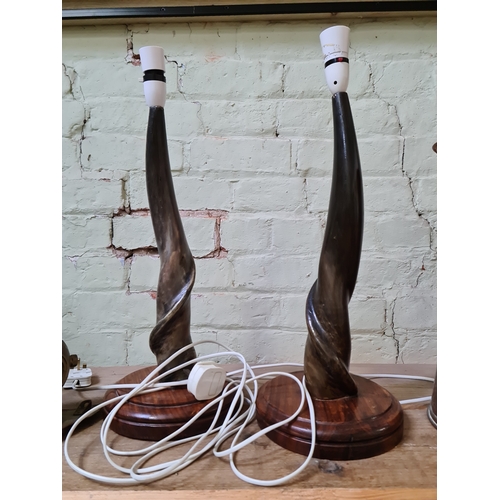 141 - A pair of Eland horn lamps.