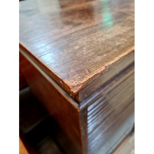 15 - An early 20th century oak tambour fronted filing cabinet/ chest of drawers, height 115.5cm.