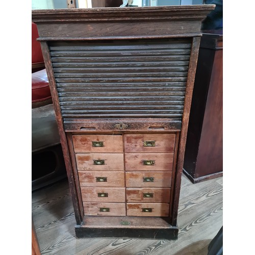 15 - An early 20th century oak tambour fronted filing cabinet/ chest of drawers, height 115.5cm.