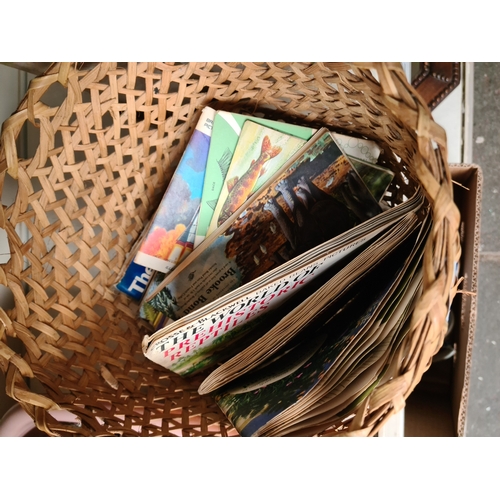 642 - A basket of cigarette cards.