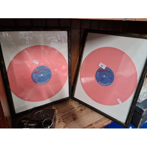 25 - Two framed pink Elvis Presley long play record LPs.
