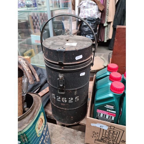 86 - A military canister.