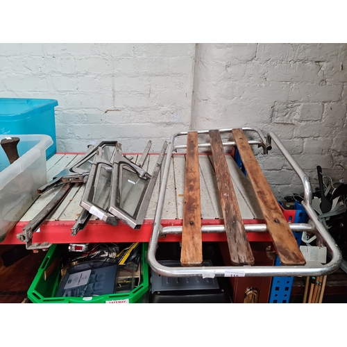 115 - A vintage car boot rack and various car door parts to include Triplex toughened glass.