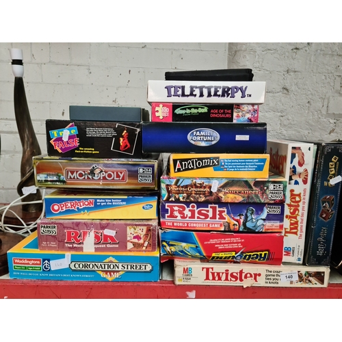 140 - A collection of board games including Risk, Operation, Twister, Monopoly etc.