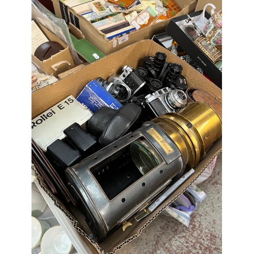 493 - A box containing cameras and binoculars including a Canon AE1, Tento binoculars, Olympus, Pentax, Ba... 