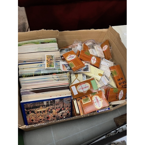 495 - A box of assorted tea and cigarette cards.