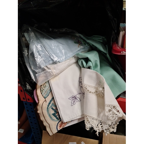 305 - A bag of linen and lace including some antique pieces.