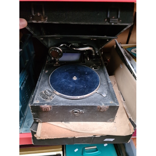 361 - A gramophone and a box of old records.