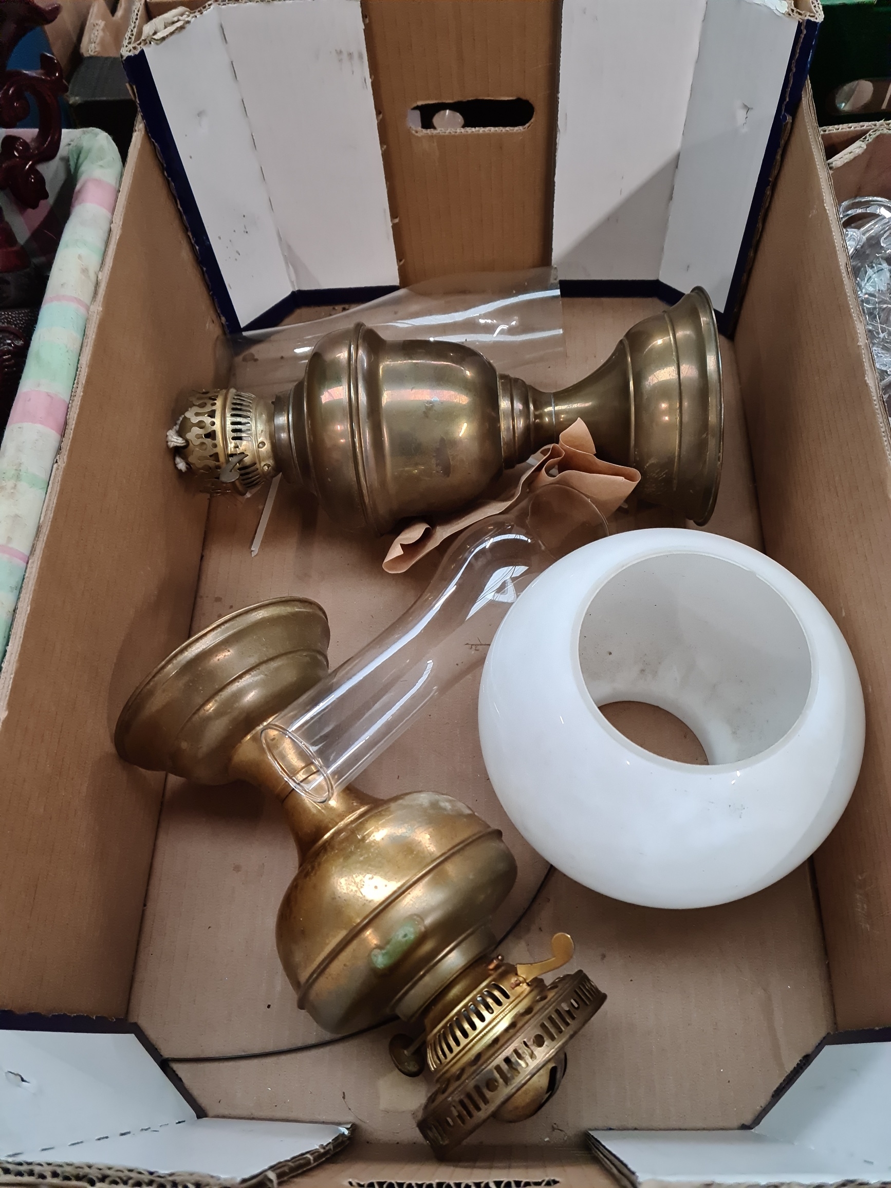 2 vintage brass oil lamps, 2 funnels, and a shade