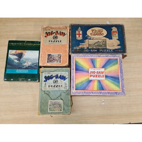 189 - A box of 11 wooden jigsaws