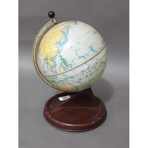 130 - A Chad Valley tin plate terrestrial globe, height 28cm.