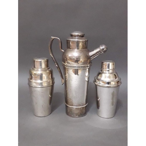 161 - A group of three silver plated cocktail shakers.