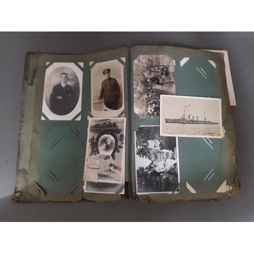 173 - An early 20th century postcard album, approx. 120 cards, mainly tourist and portraits.