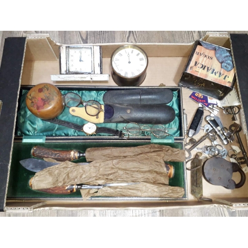 201 - A box of assorted items including two pairs of gold plated spectacles, penknives, clocks, keys etc.