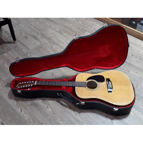 213 - A Fender 12 string acoustic guitar, model F-55-12, S No F 705 7/6, in hard case.