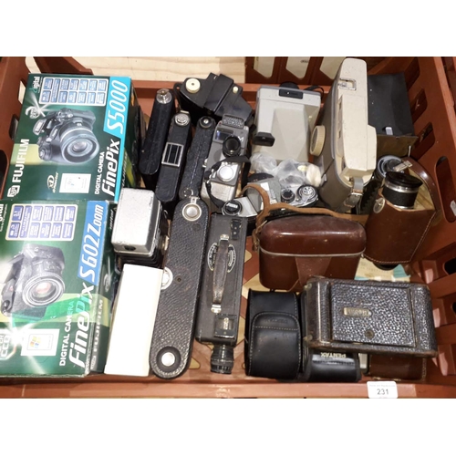 231 - A box of assorted vintage cameras including Pentax, Kodak etc.