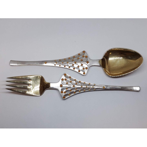 74 - A pair of Danish silver fork and spoon, marked 'A. Michelsen Sterling Denmark', wt. 92g.