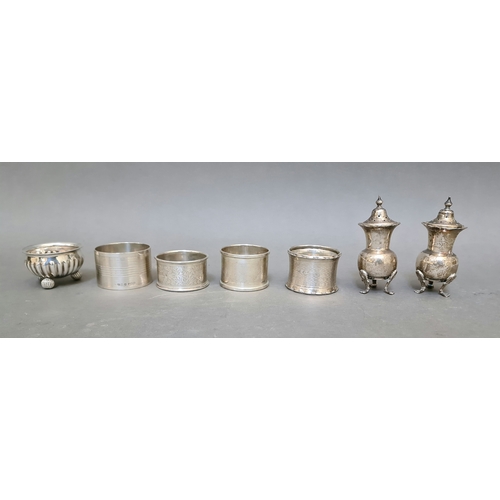 22 - A pair of hallmarked silver pepper and salt pots, a white metal small bowl and four various hallmark... 