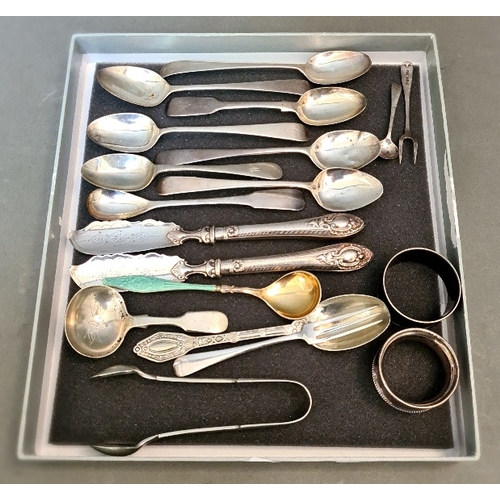 32 - A collection of hallmarked silver items including various spoons, two master butter spreaders, two n... 