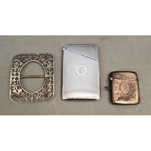 34 - A collection of silver and white metal items including a cards case, a vesta case and a buckle, gros... 