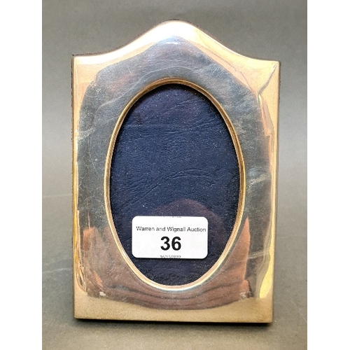 36 - A hallmarked silver and velour backed photo frame, T K C, Birmingham, 1999 with millennium mark.