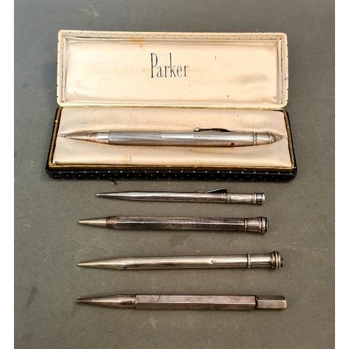 42 - A collection of 4 hallmarked silver pencils and one other.