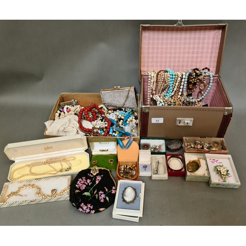 51 - A case and a box of various costume jewellery to include brooches, bracelets, necklaces, rings, some... 