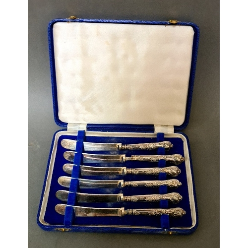 84 - A set of 6 silver handled knifes in case, C H Beatson, Sheffield, 1931.