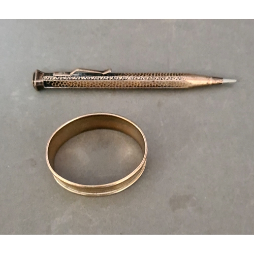 85 - A hallmarked silver pencil, marked 800 and a silver napkin ring.