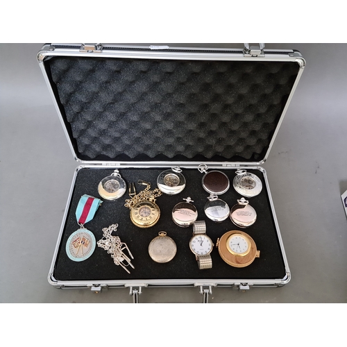 90 - An aluminium case containing various pocket watches, etc.